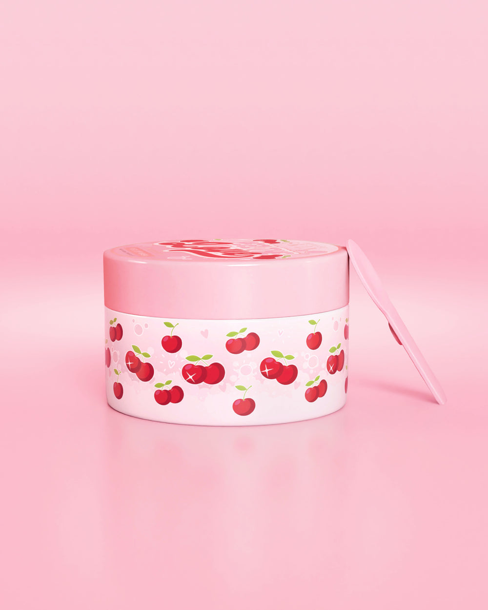 Contenedor rosa con diseño de cereza sobre fondo rosa