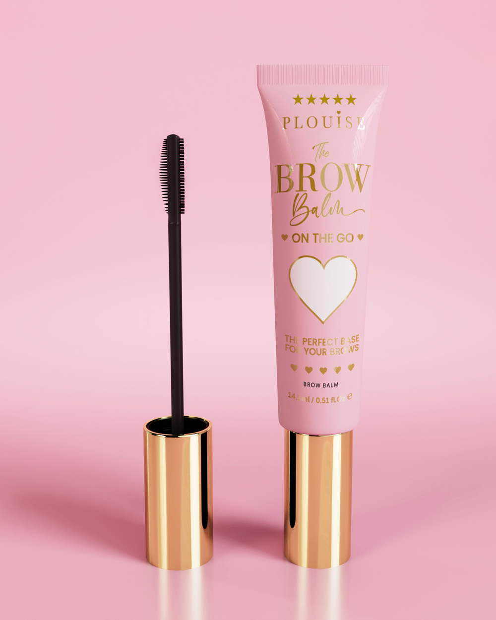 Producto P.Louise Fluffy Soap Brow Balm Instant Fix en un tubo rosa con tapa dorada, acompañado de un cepillo para cejas negro, mostrado sobre un fondo rosa.
