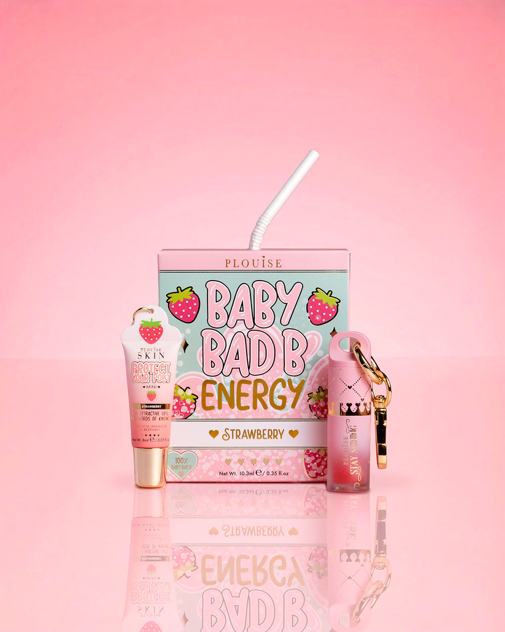 P.Louise Strawberry Baby Bad B Mini Lip Oil & Mini Lip Conditioner auf rosa Hintergrund
