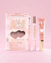 Das kosmetische Augenbrauenset „It's A Match“ enthält den P.Louise Signature Blend Pen, den Blade & Fade Brow Pencil und den Brow Balm, verpackt in pink- und goldfarbenen Boxen mit Herzmotiven.