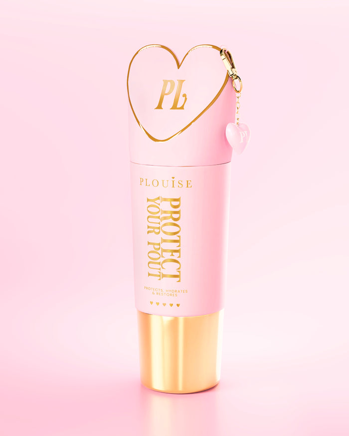 Giant pink and gold Protect Your Pout bottle with heart-shaped cap on a light pink background